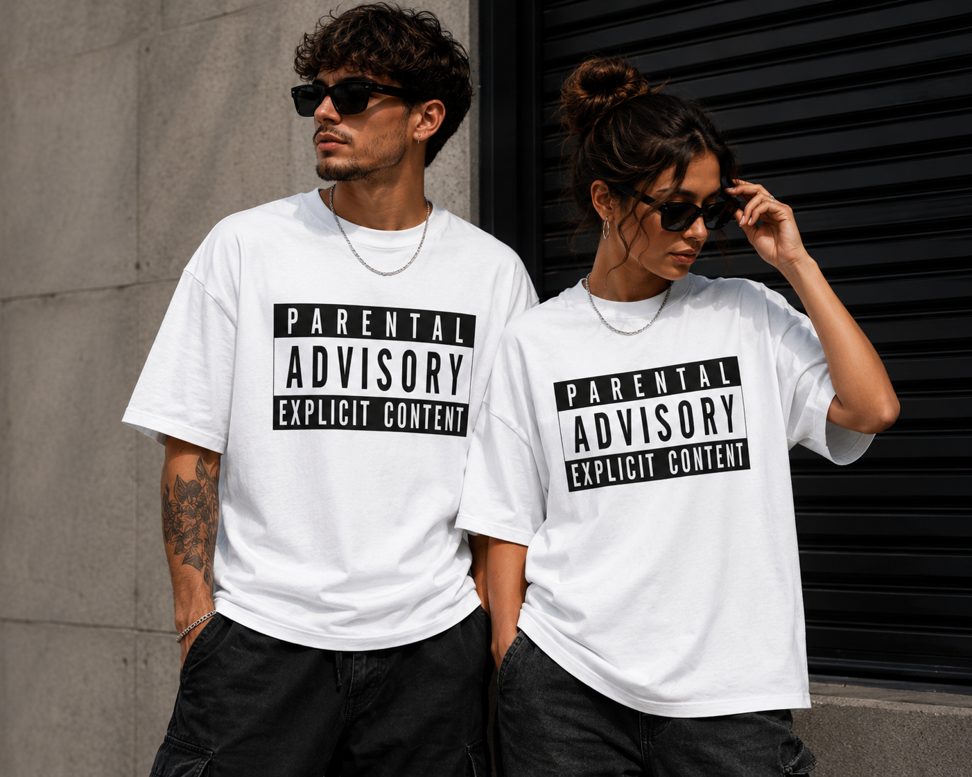 Parental Advisory Explicit Content graphic t-shirt on male and female models wearing white unisex streetwear graphic tees with bold black statement print.